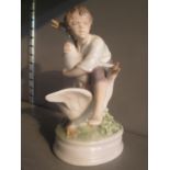 A Royal Copenhagen figure of a boy with two geese, model no 2139