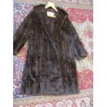 A Maxwell Croft, late 20th century dark brown mink full length coat with shawl collar, 38" chest x