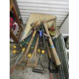 Mixed tools and wheelbarrow to include a pick, wooden handled forks, a rake and two metal ladders