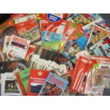 A box of football programmes, mainly Manchester United home and away 1970s and 80s, along with other