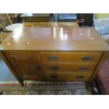 An Edwardian washstand with a door and three drawers and a similar dressing table with two long