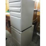 Two grey metal filing cabinets of various sizes