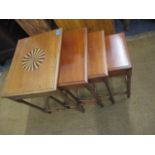 A quartetto nest of mahogany tables with bamboo design supports, the larger table having a marquetry