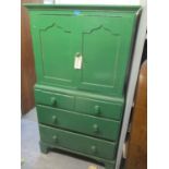 A Victorian green painted small linenpress having two cupboard doors above two short and two long