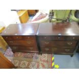 A pair of Stagg mahogany low chests of drawers, three short drawers above two long drawers on