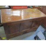 An 18th century oak panelled coffer having a hinged top and two drawers, 32 1/4"h x 50"w