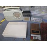 Vintage Bush radio along with a Silver Reed colour Pengraph EB50 typewriter and two desktop speakers