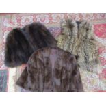 A wolf fur waistcoat, a vintage dark brown cape and a vintage dark brown mink cape
