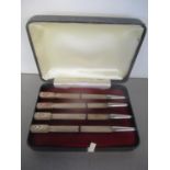 A cased set of four sterling silver bridge pencils