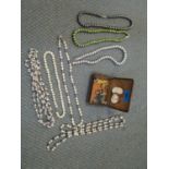 A selection of jewellery to include pearl beaded necklaces, to shell cameo brooches, a silver and