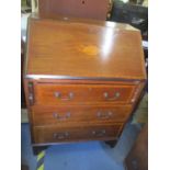 An Edwardian walnut bureau having fall flap above three drawers, 37 1/2"h x 27"w