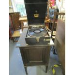 The Barkingside East Light early 20th century oak cased gramophone record cabinet with a selection