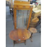 A 1930s oak display cabinet, an oak occasional table and a pedestal table