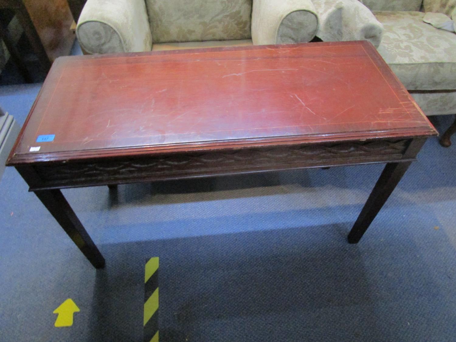 A mahogany side table with string inlay and crossbanded top with moulded edge, blind fretwork frieze