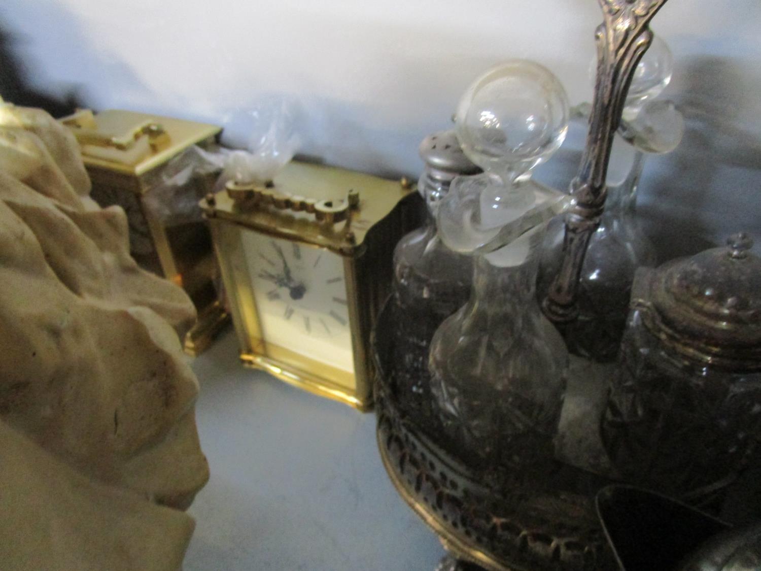 An early 20th century plaster figurine of a young girl, a silver plated four bottle cruet set, a - Image 2 of 3