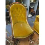A Victorian walnut button back nursing chair on two front cabriole legs