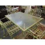A cast metal garden table and a glass top with six matching chairs