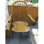 A Windsor armchair with elm seat, marked TW to the seat edge