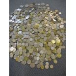 A large quantity of loose coins to include Commemorative British crowns, Greek coins and Asian coins