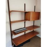 A Ladderax style wall unit with single cupboard and open shelves