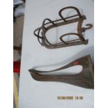 A cast iron saddle stand and a horse tack stand