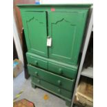 A Victorian green painted small linenpress having two cupboard doors above two short and two long