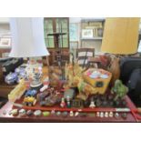 A mixed lot to include a pair of 19th century leather child's slippers, table lamps, vintage toys,