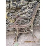 A pair of cast iron metal bench ends