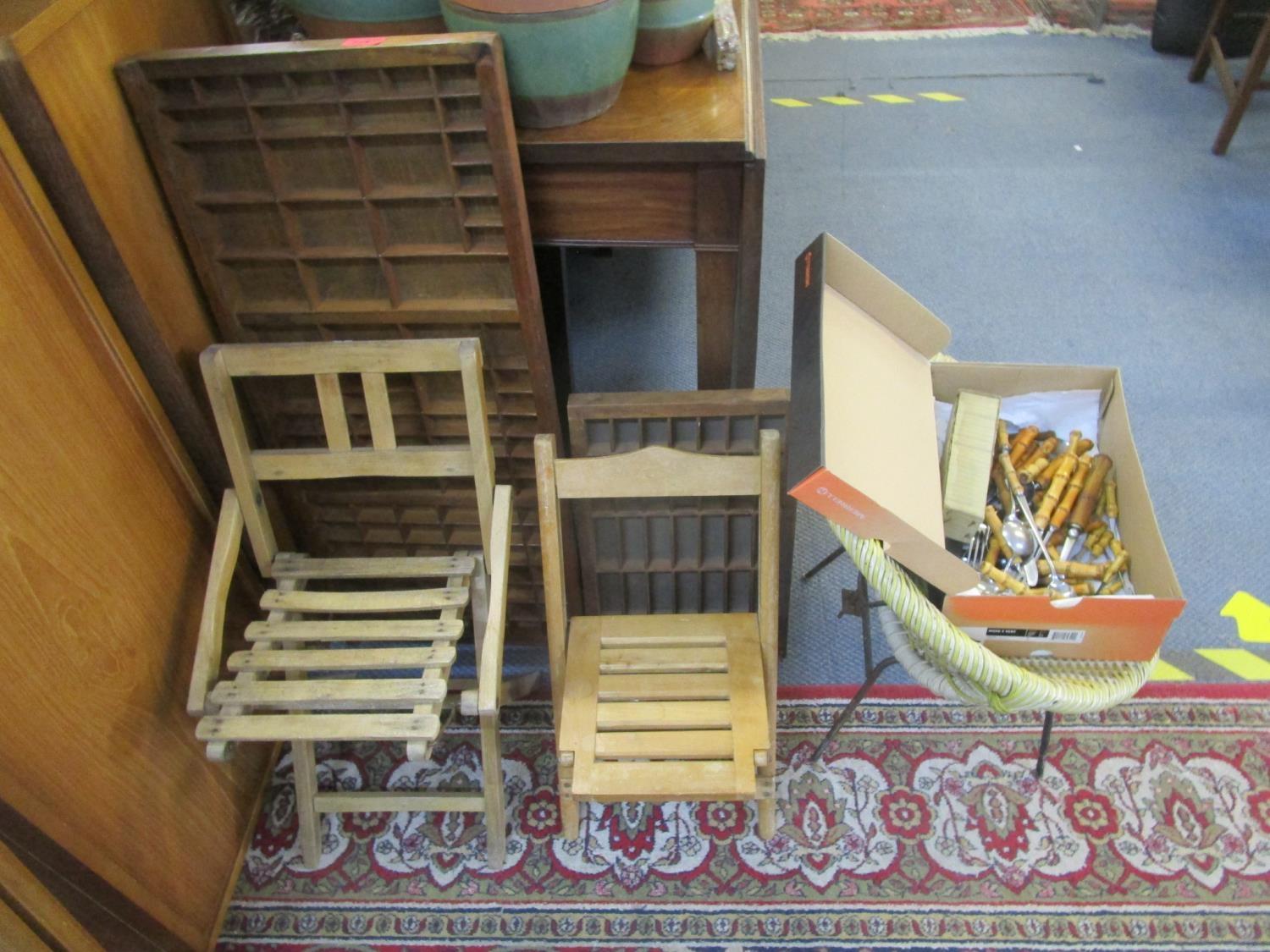 A mixed lot of wooden ware to include two printers trays, two folding child's chairs, bamboo handled