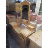 A Victorian pine dressing table having attached swing mirror and short spindle supports 67 1/2"h x