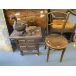 A Asian hardwood two drawer side cabinet and a Victorian penny seated chair, along with two Indian