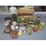 A Henniez Lithinet wooden crate containing a mixed lot to include vintage tins, two cameras, oil