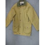 A Barbour gents tweed coat with side hand warmer pockets and lower bellowed pockets with contrasting