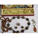 A silver and tigers eye necklace with matching clip on earrings and other hardstone and bone items