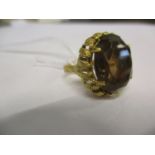 An 18ct gold and topaz dress ring. Total weight 7.7g. Ring size 'H'