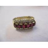 An 18ct gold ring set with rubies and diamonds, 4.4g