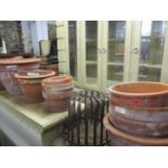 A quantity of terracotta garden pots, together with a vintage cage planter