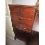 A Victorian mahogany music cabinet having five drawers with an open shelf below 40"h x 19 1/4"w