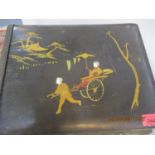 An early 20th century Japanese lacquered and painted photograph album containing various portraits