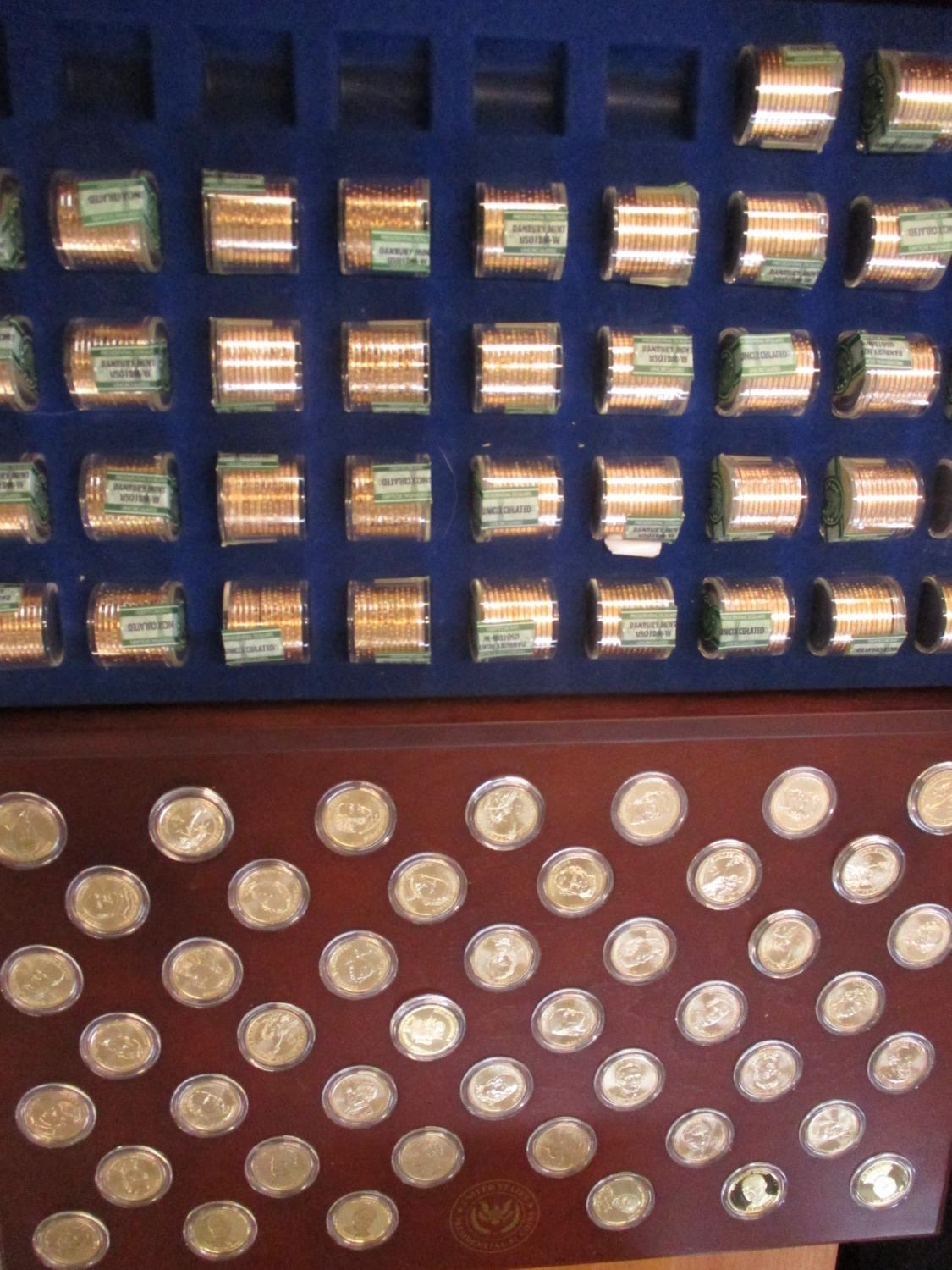 A United States Presidential Coins contained in a mahogany finished case
