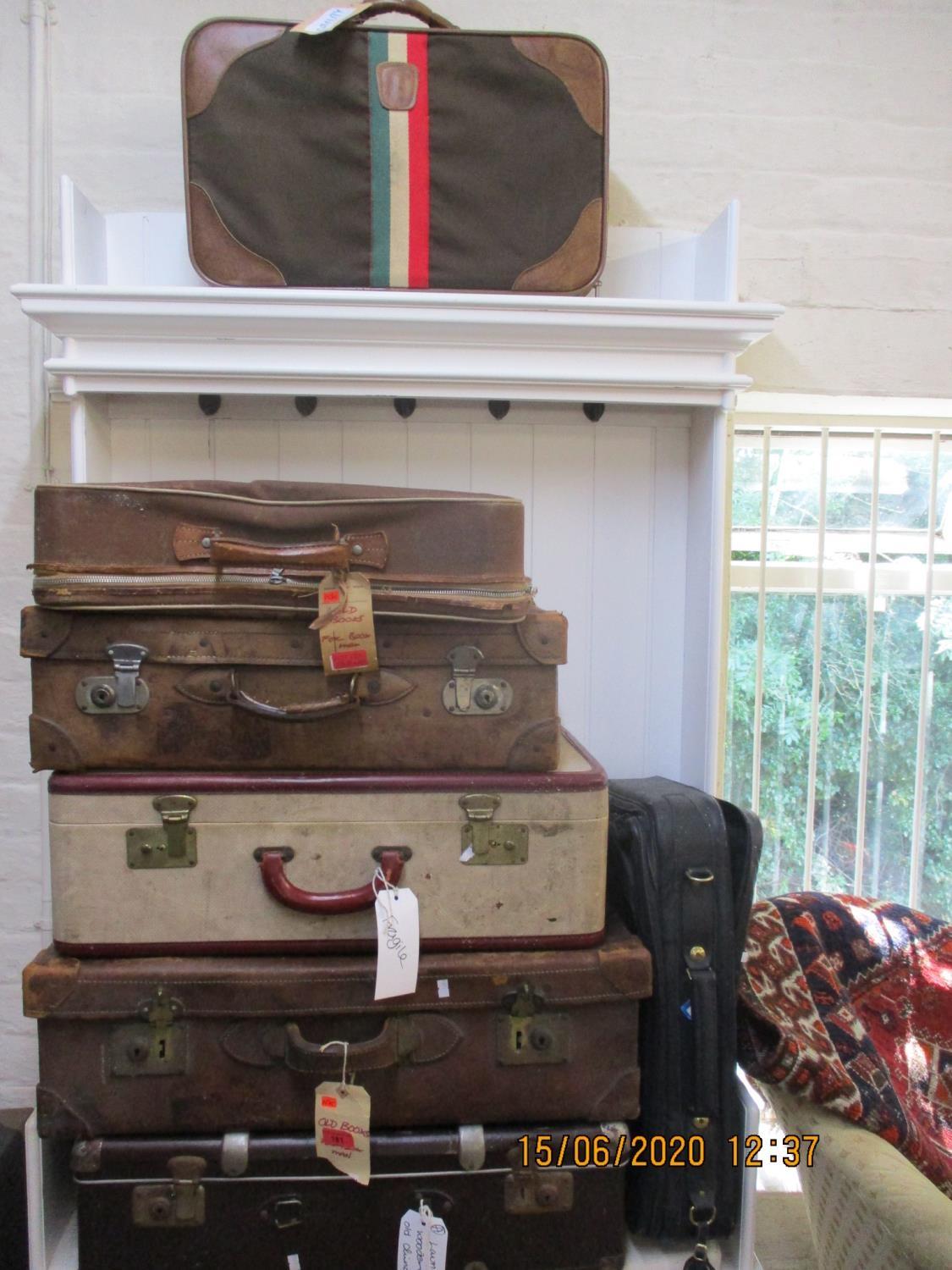 Eight vintage suitcases to include leather examples