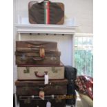 Eight vintage suitcases to include leather examples