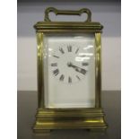 A mid 20th century French brass five window carriage clock with key