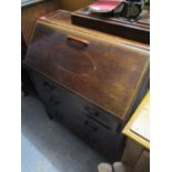 An Edwardian mahogany bureau having a fall flap above three drawers 36"h x 29 1/2"w