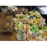 A collection of vintage ceramic, metal, wooden and glass novelty egg cups, miscellaneous egg cup