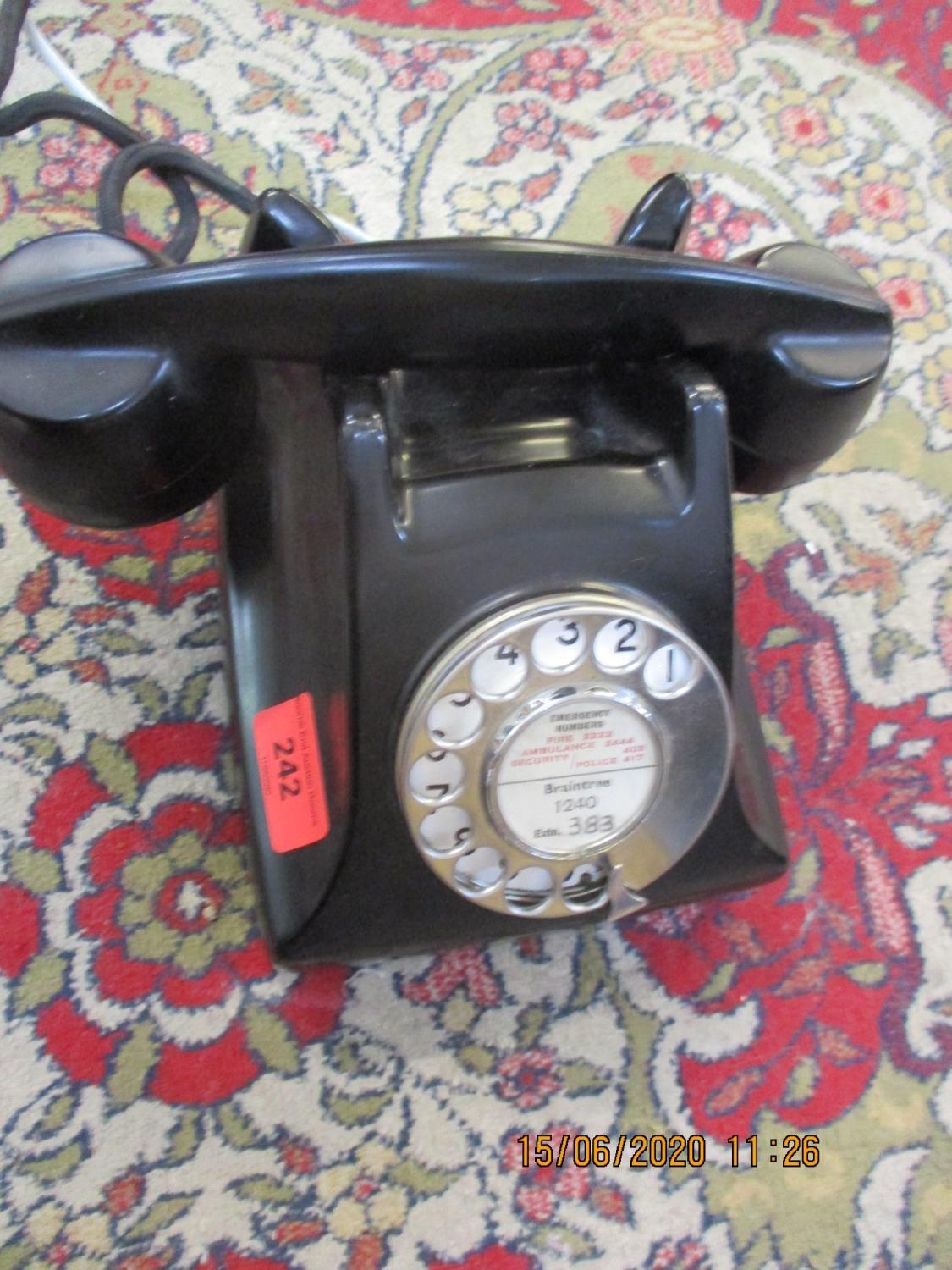 An Ericsson black Bakelite telephone