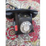 An Ericsson black Bakelite telephone