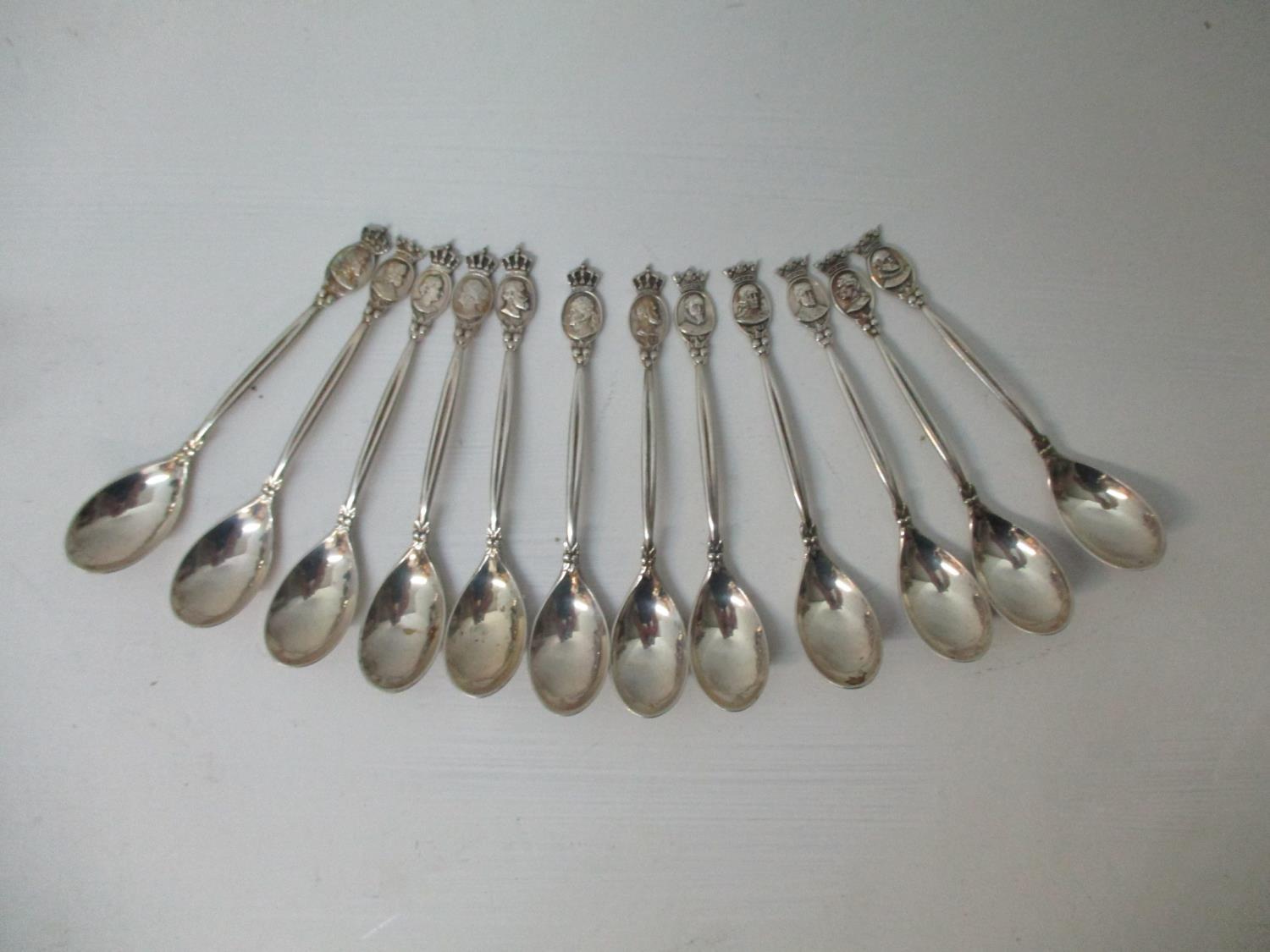 A set of twelve early 20th century Dutch white metal coffee spoons, by Gerritsen & Van Kempen, the