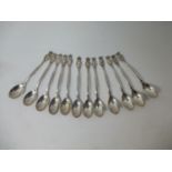 A set of twelve early 20th century Dutch white metal coffee spoons, by Gerritsen & Van Kempen, the