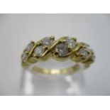 A yellow gold coloured metal diamond half loop, eternity ring set with five pairs of diamonds in a